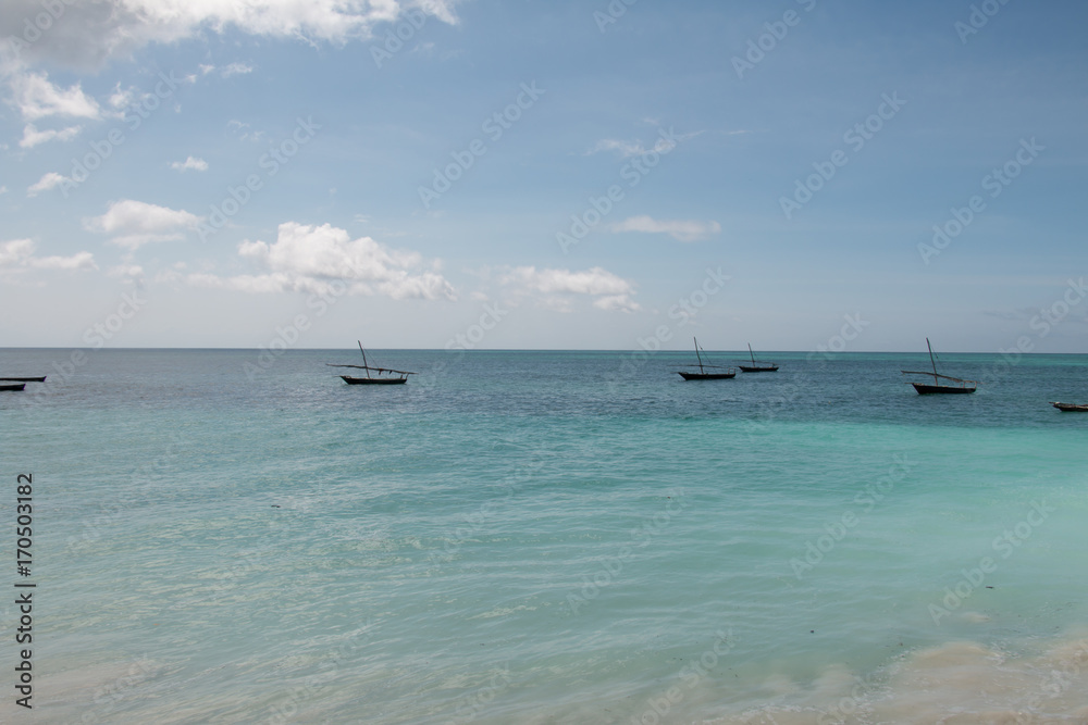 Dhows anchored off the Nungwi Beach in Zanzibar