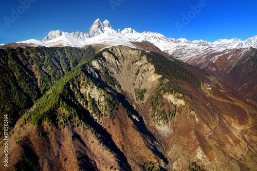 Spectacular Mount Ushba, located on southern slope of the Causacus Mountains, view from Zuruldi mount in Hatsvali, Upper Svaneti region of Georgia photo