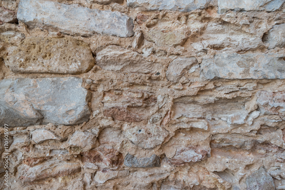 Stone wall of old limestone stones. Abstract texture Stone wall of old limestone stones. Abstract texture