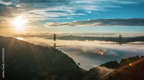 Wide time lapse shot of Golden Gate Bridge Covered in Fog