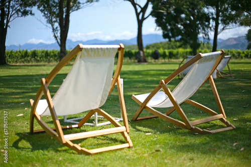 Summery scenes with deckchairs on the lawn of a vineyard in Marlborough, New Zealand