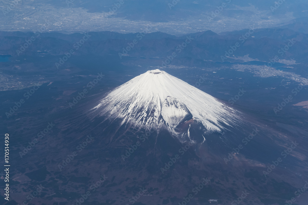 Top of Mountain Fuji with snow in winter season , taken from on airplane after takeoff from Tokyo Haneda international airport