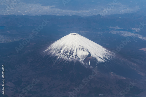 Top of Mountain Fuji with snow in winter season , taken from on airplane after takeoff from Tokyo Haneda international airport