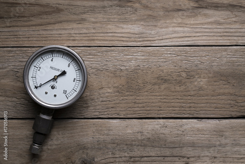 pressure gauge on wood background