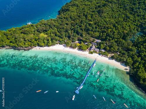 Aerial view or top view of tropical island beach with clear water at Banana beach, Coral Island, Koh Hey, Phuket photo