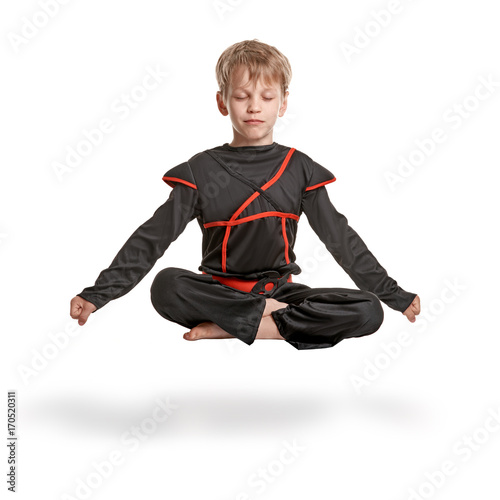 Young ninja meditating photo