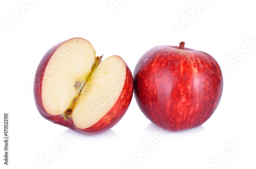 whole and cut ripe apple on white background