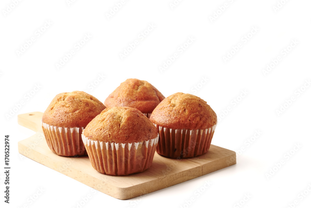 Banana cupcakes on a wooden tray, white background, Free space for text. Banana cupcakes on a wooden tray, white background, Free space for text.