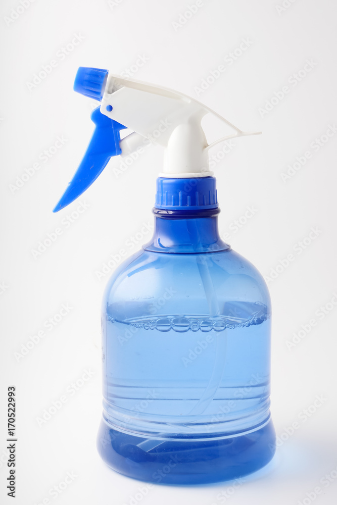 Spray bottle on a white background. Splashing water. Spray bottle on a white background. Splashing water.