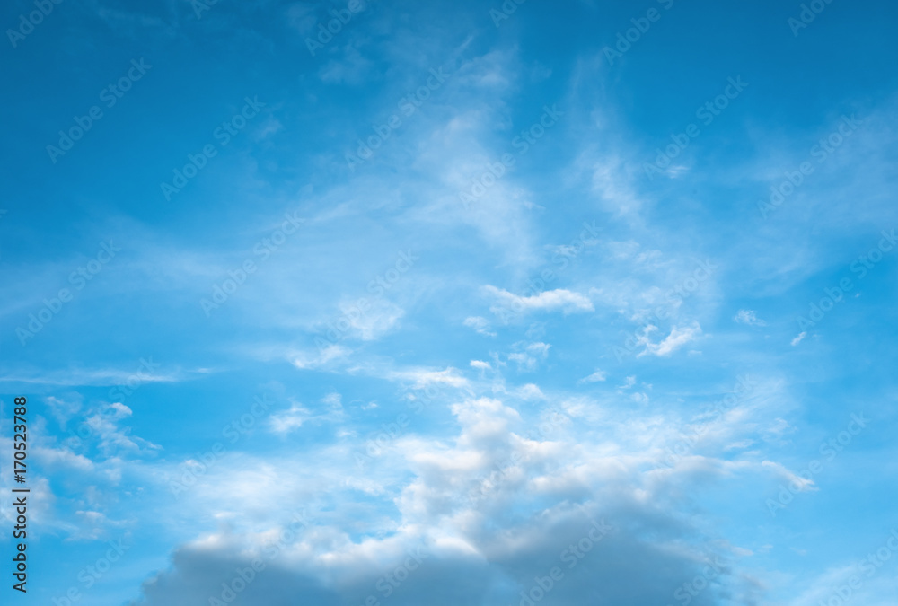 Beautiful blue gradient sky with smoke clouds. Magical fantasy background