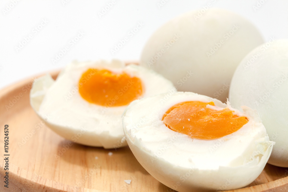 salted egg on wooden plate salted egg on wooden plate