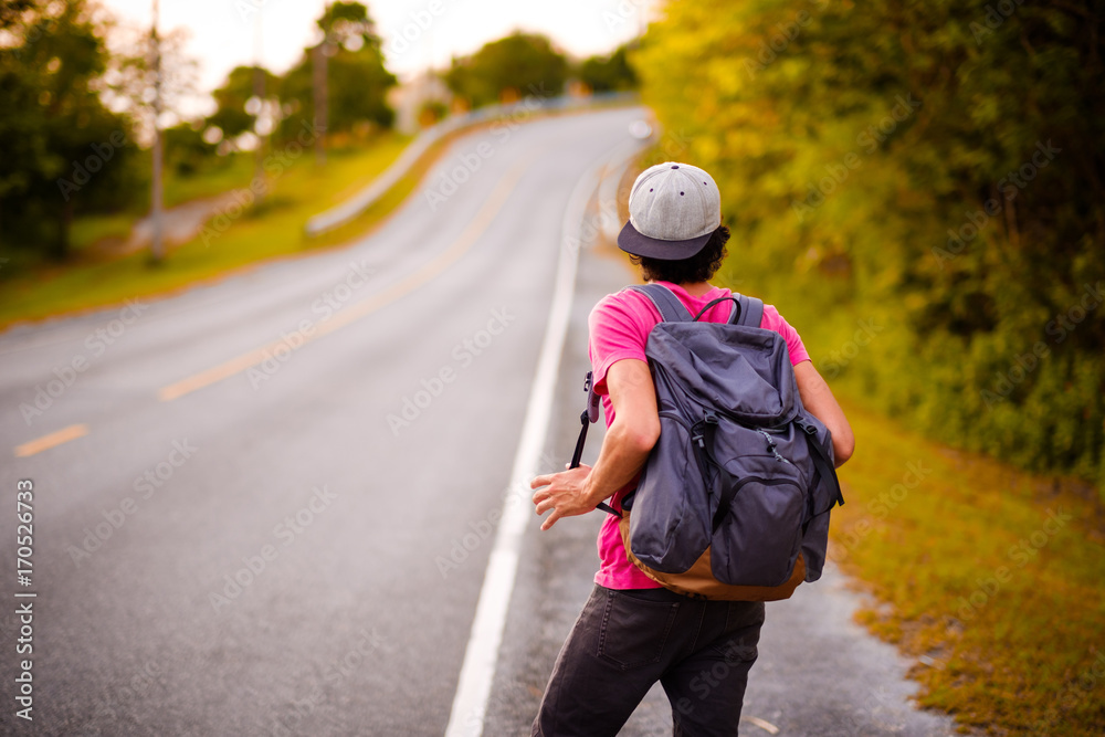 man traveling walking with backpack at national park in the jungle day time sun shine on holiday at weekend relax fresh on background nature view man traveling walking with backpack at national park in the jungle day time sun shine on holiday at weekend relax fresh on background nature view