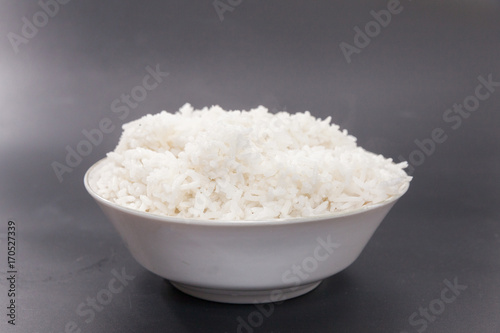 cooked rice on bowl on black background