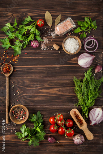 herbs and spices on wooden background. Food background. Cooking concept.