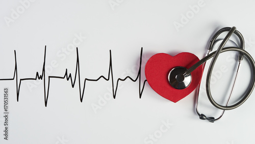 Medical stethoscope and red heart with cardiogram
