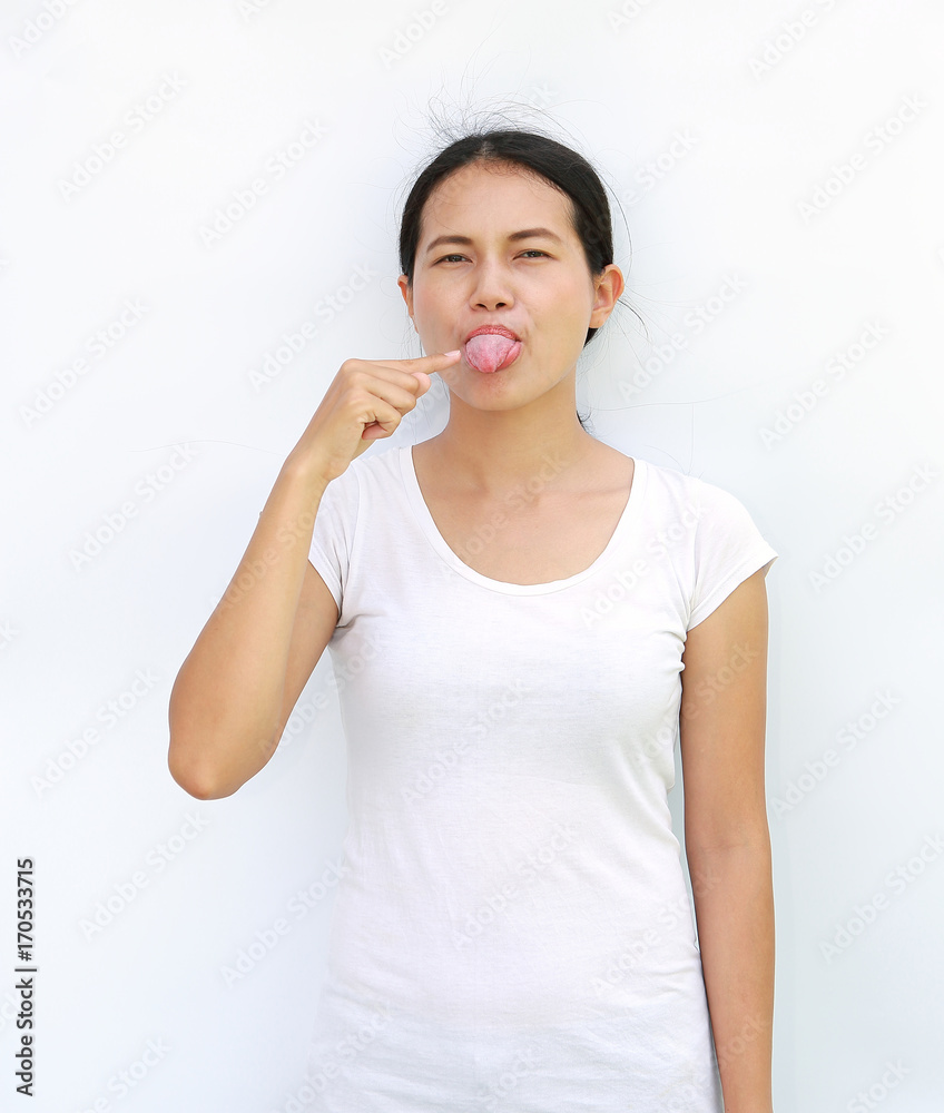 Young asian woman in T-Shirt Showing expression point the Tongue. Young asian woman in T-Shirt Showing expression point the Tongue.