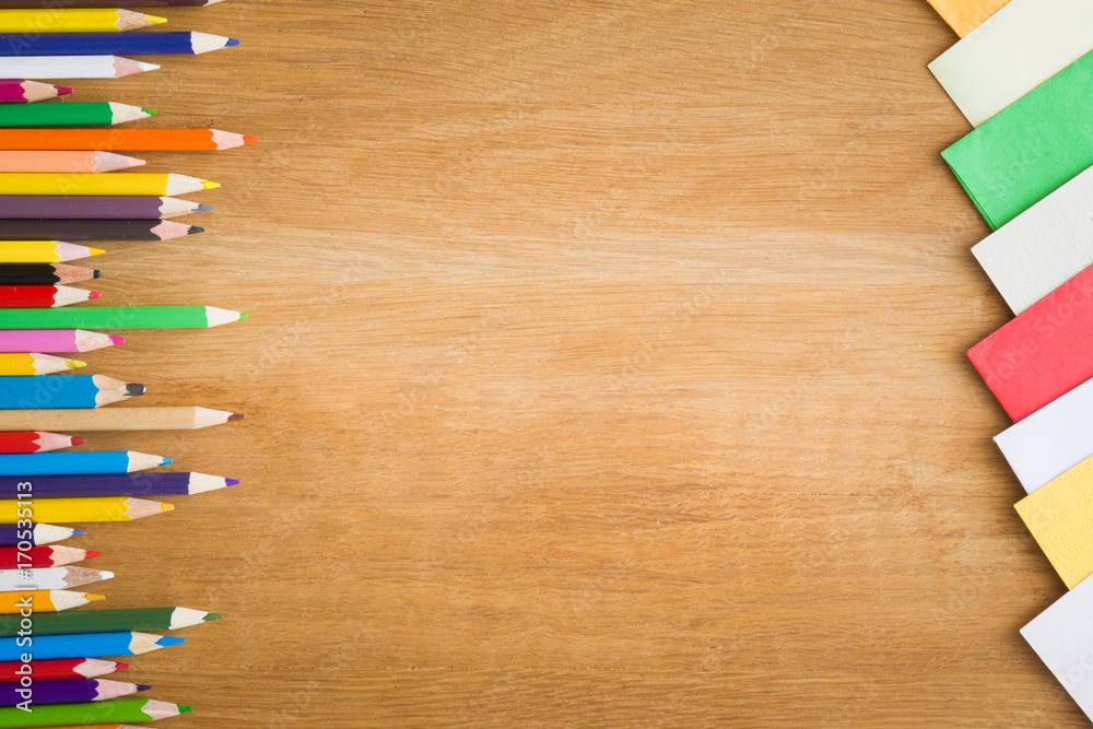 Obraz premium Color pencils on the wooden table. Art concept. Top view. Empty place for a text or drawing on the background.