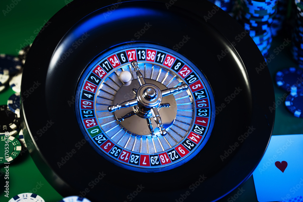 Roulette in casino and Poker Chips Roulette in casino and Poker Chips