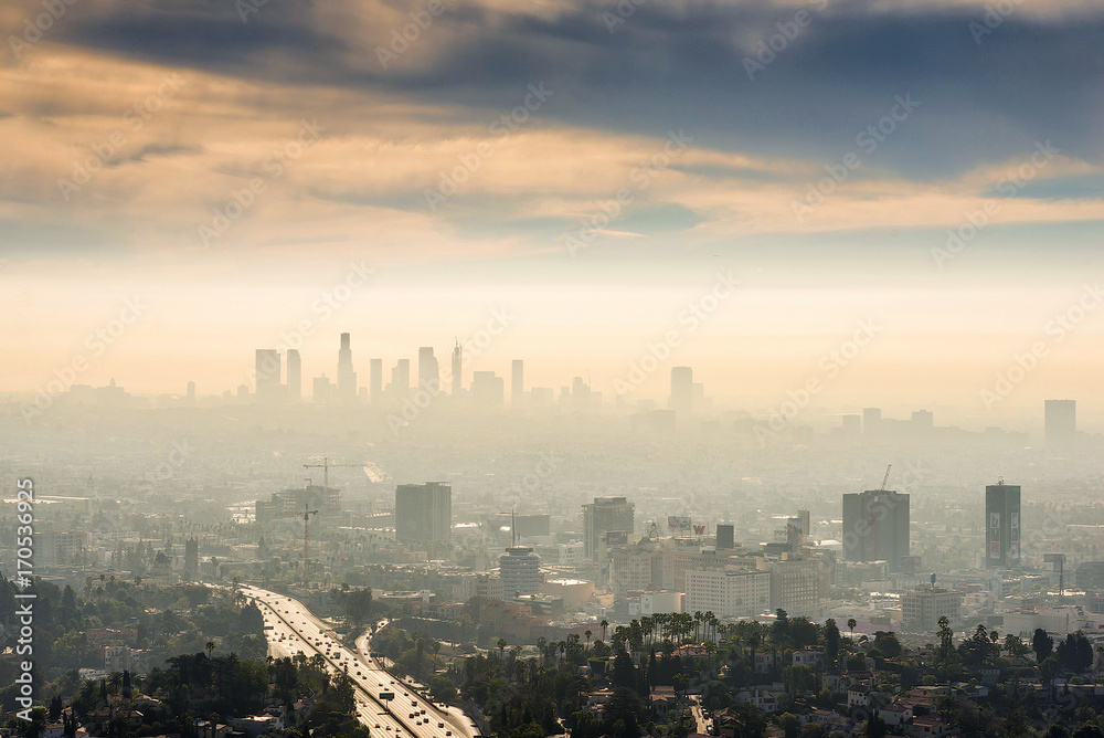 Smoggy morning sunrise overlooking downtown Los Angeles from Hollywood Hills - obrazy, fototapety, plakaty 