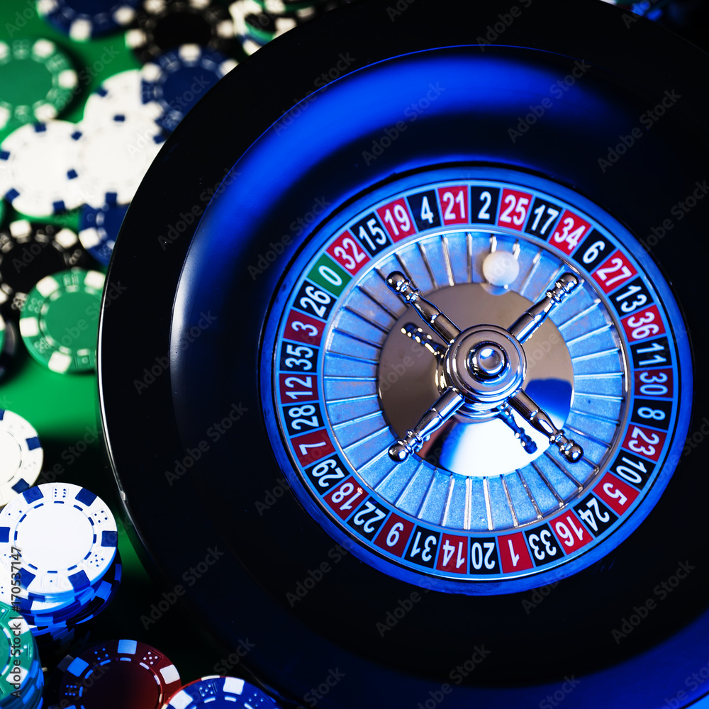 Roulette in casino and Poker Chips Roulette in casino and Poker Chips