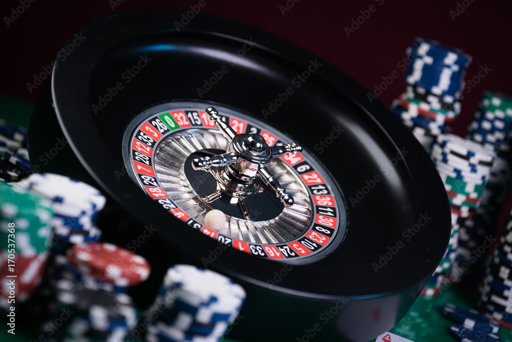 Roulette in casino and Poker Chips Roulette in casino and Poker Chips