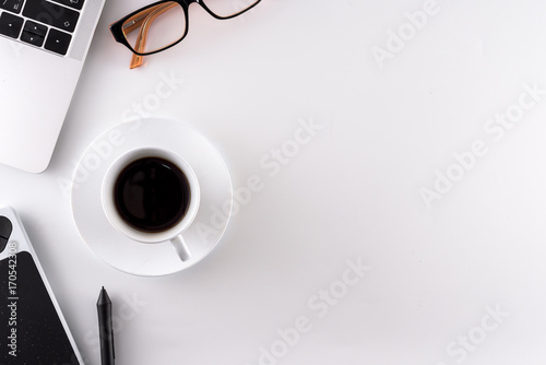 Graphic design table has ready hard working with black coffee in the morning.