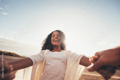 African woman spinning with her boyfriend