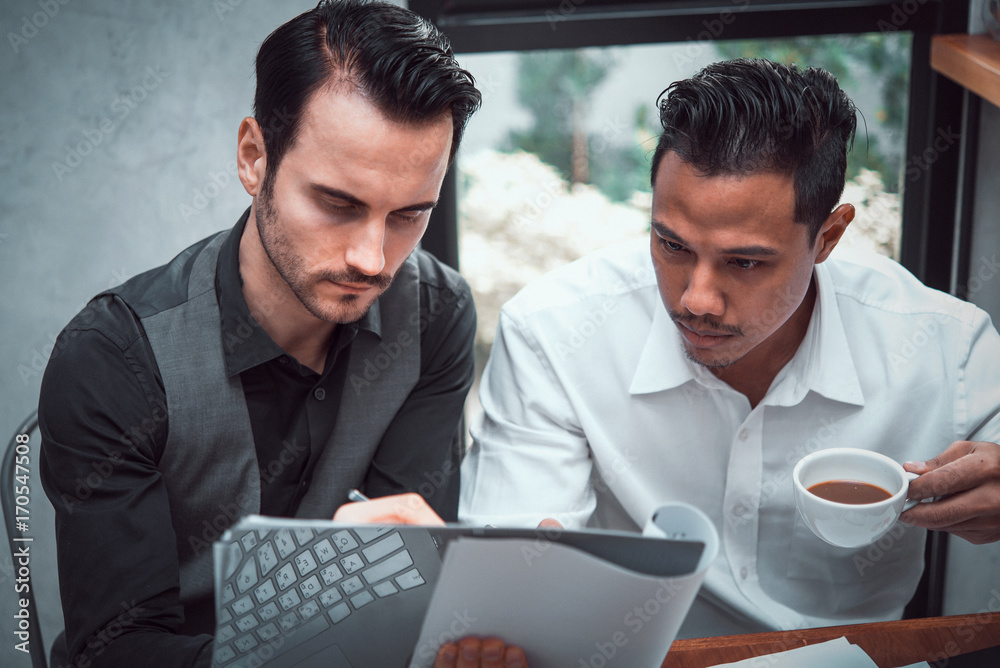 Two business man working together at office  