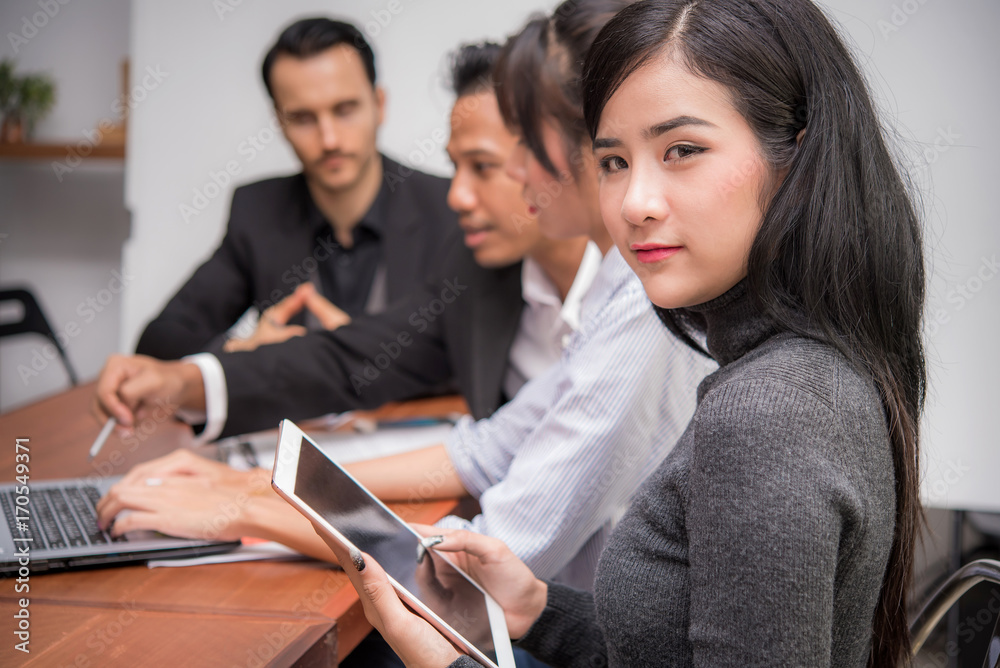 Beauty Asian business woman using tablet at meeting Beauty Asian business woman using tablet at meeting