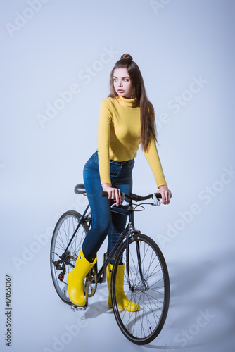 fashionable girl with bicycle