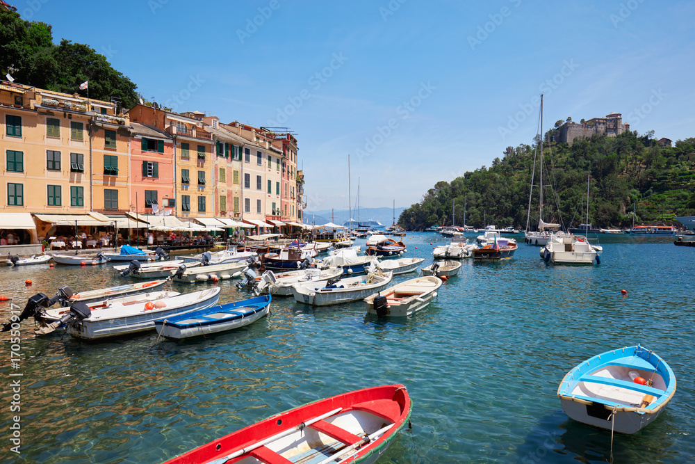Portofino typical village with colorful houses and small harbor with boats in Italy, Liguria
