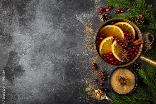 Christmas food background , mulled wine and ingredients on dark grey concrete surface