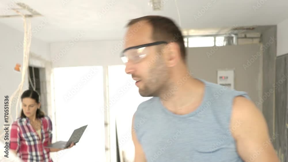 Man holding panels and tablet while talking to the camera about it, steadycam shot
Man holding panels and tablet while talking to the camera about it, steadycam shot
