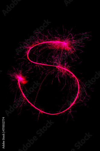 English alphabet from sparkler on black background,Alphabet big letter photo