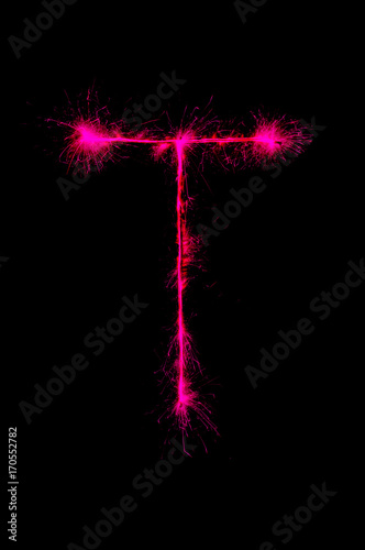 English alphabet from sparkler on black background,Alphabet big letter photo