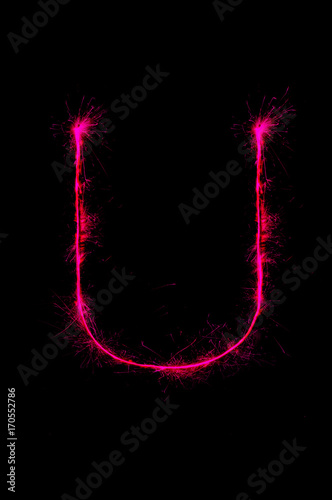 English alphabet from sparkler on black background,Alphabet big letter photo