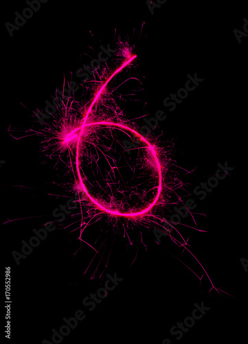 "6" number drawn with bengali sparkles isolated on black background,number from sparkler on black background