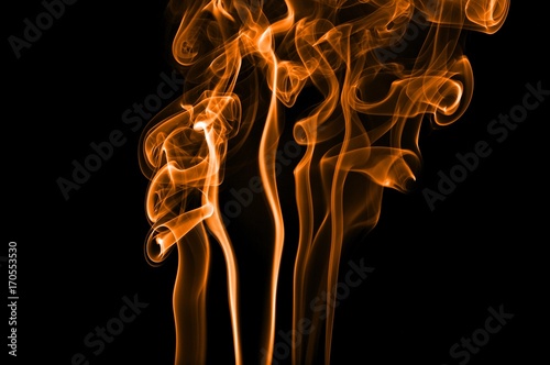 Abstract color smoke on black background, orange smoke background,orangeink background,orange smoke, beautiful color smoke photo