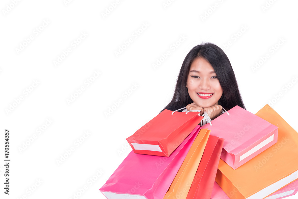 Cheerful shopping woman of Asian holding bags. Shopping smart business woman happy smiling holding colorful shopping bags isolated on white . Fresh young Asian female model Cheerful shopping woman of Asian holding bags. Shopping smart business woman happy smiling holding colorful shopping bags isolated on white . Fresh young Asian female model