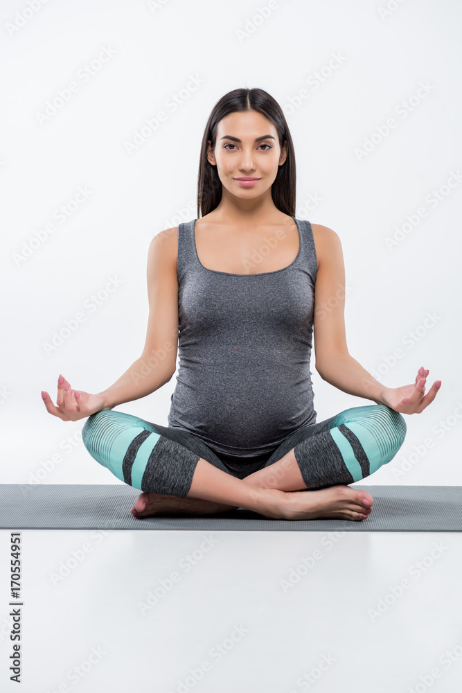 Fototapeta premium pregnant woman in lotus pose