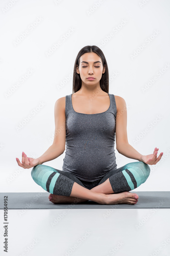 pregnant woman in lotus pose