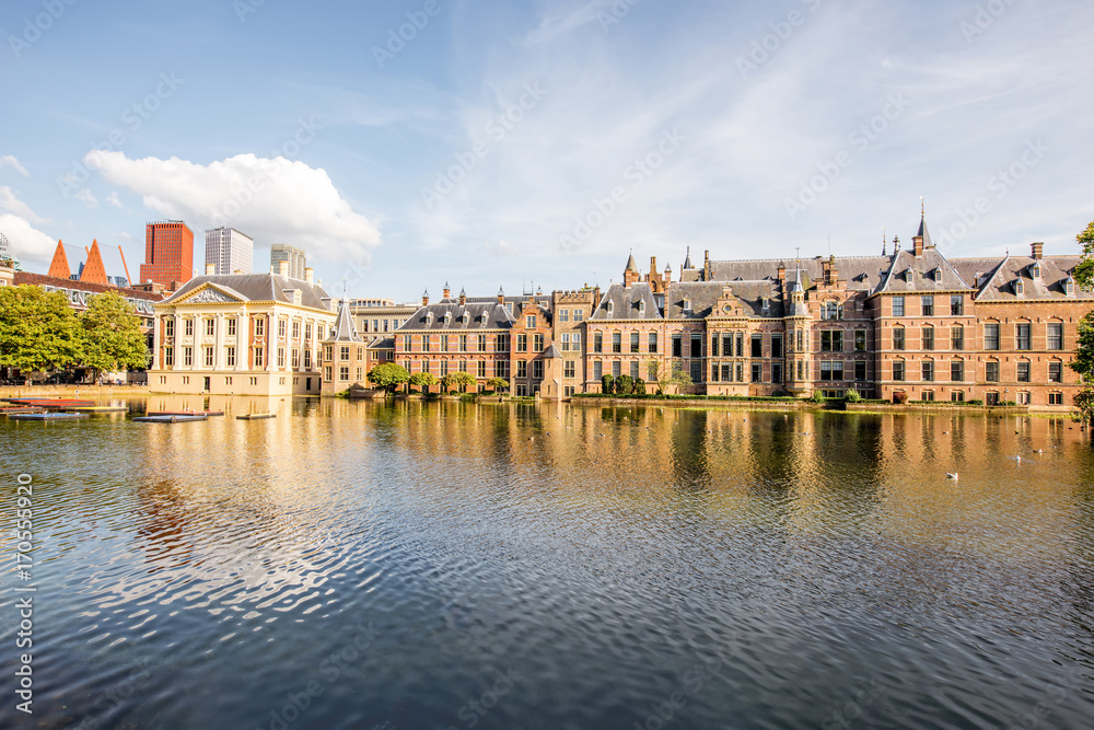 Cityscape view on the small lake with beautiful old buildings and modern skyscrapers on the background in the centre of Haag city, Netherland