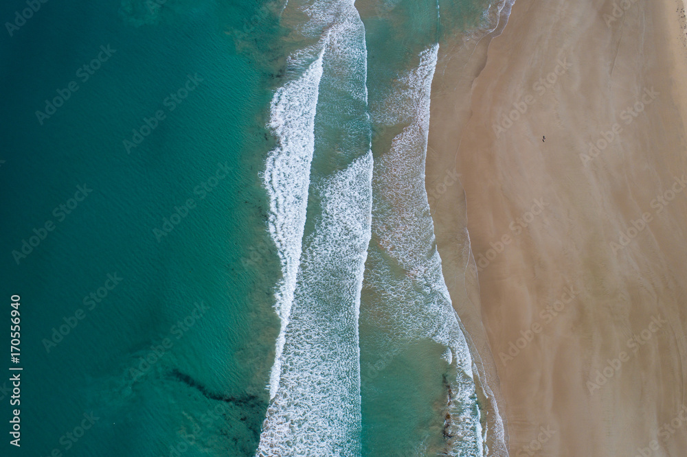 Aerial perspective of waves on the beach, Anglesea