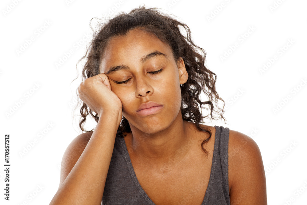 dark skinned woman asleep leaning on her hand