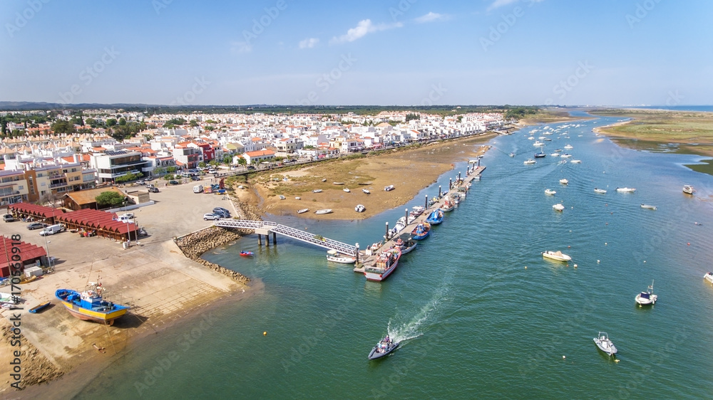 Aerial. Port, pier of fishing ships. View from the sky, Cabanas Tavira