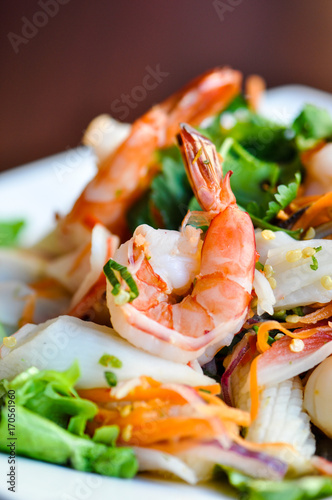 Seafood Salad, Mixed seafood, onion, carrot and cilantro in a spicy lime sauce.