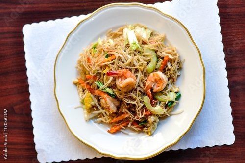 Shanghai Noodle, Stir-fried vermicelli rice noodles with egg, carrots, napa, onion, celery and bean sprout. photo