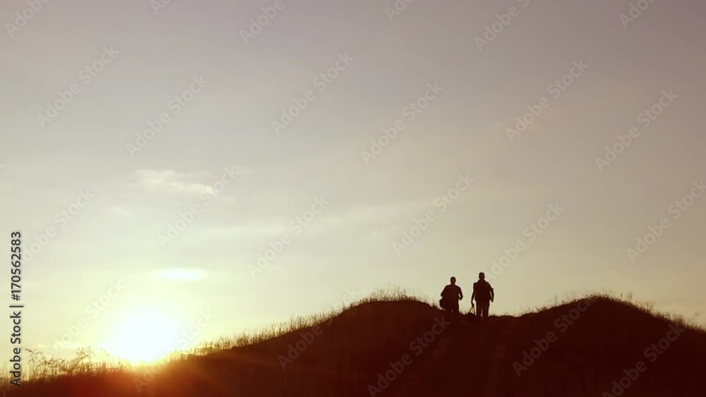 people group of tourists walking on top of a travel sunset silhouette mountain. slow video tourists people group go nature people group of tourists walking on top of a travel sunset silhouette mountain. slow video tourists people group go nature
