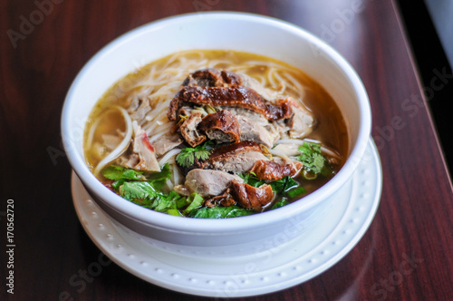 Duck Noodle Soup, Thin rice or egg noodles with bean sprouts, green onion & cilantro in the broth.