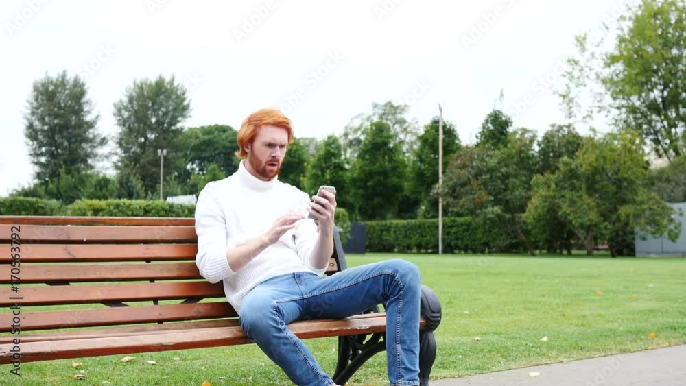 Failure, Loss Gesture by Man Using Smartphone, Sitting on Bench Outdoor Failure, Loss Gesture by Man Using Smartphone, Sitting on Bench Outdoor